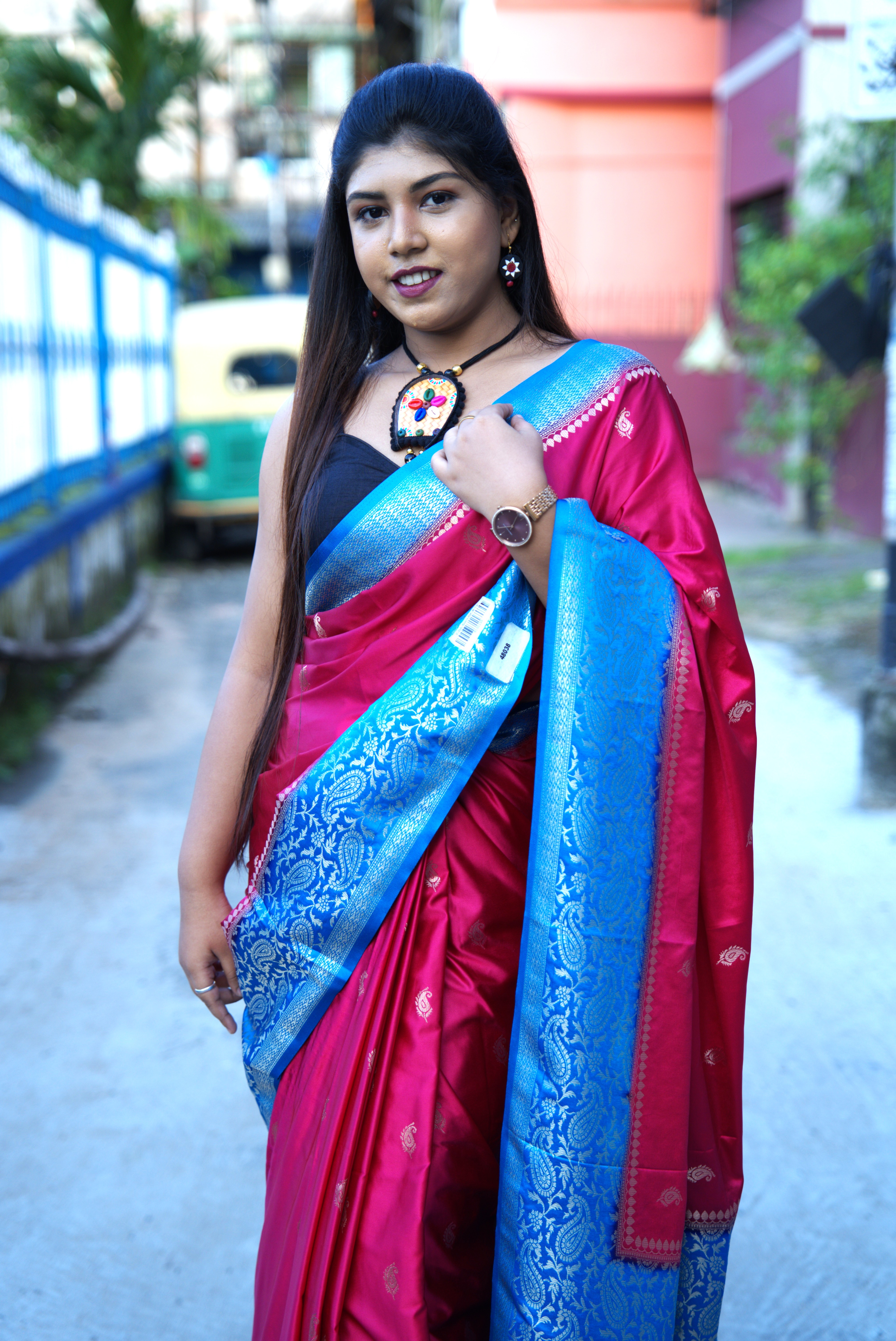 Magenta-pink gajji silk saree with a royal blue woven zari border and pallu